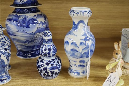 An Asian blue and white inverted pyriform jar and cover, a similar pair of smaller vases and two other items, H 25cm (largest)